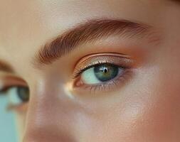 close up of a woman's eyes with a light brown eye shadow photo