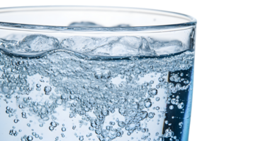 Closeup of Sparkling Water in Glass with Bubbles and Ice png