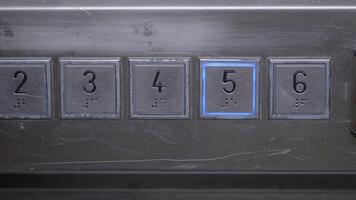 Elevator buttons in a public building captured from close range video