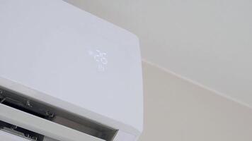 Air conditioning unit displaying temperature during summer heat video