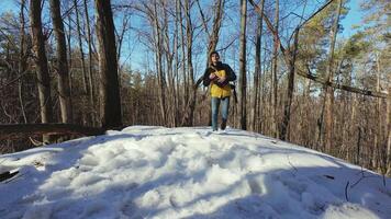 A person standing on top of a snow covered hill video