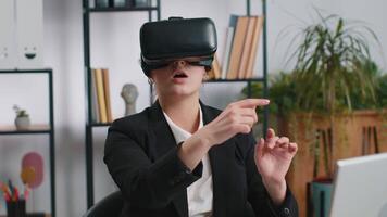 Business woman using virtual reality futuristic technology VR app headset to simulation 3D video