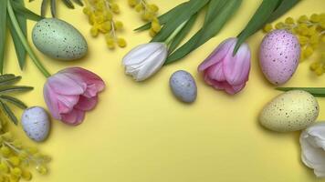 Easter eggs and spring flowers creating festive border on yellow video