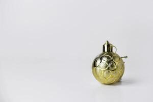 Gold Christmas Ball Ornament on White Background photo