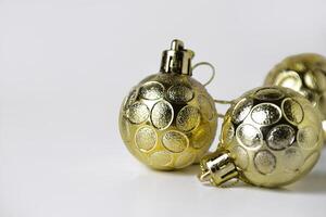Closeup of three gold Christmas ball ornaments with textured designs photo
