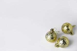 Top view of three golden Christmas ornaments with textured patterns photo