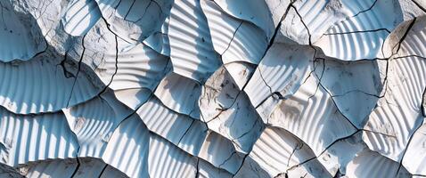 A close up of a white wall with many cracks photo