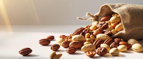 Assorted nuts in a burlap bag with a rustic texture showcasing the variety of healthy snacking options. photo