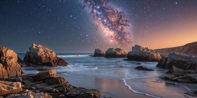The milky way over the ocean in the night sky photo