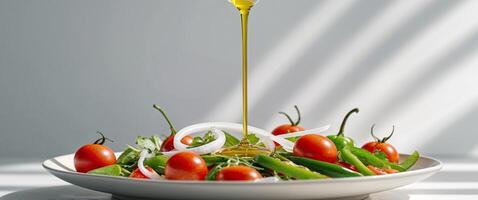 Olive oil pouring over a fresh salad with tomatoes peppers and onions a healthy and delicious dish photo