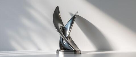 An asymmetrical titanium trophy featuring a sleek reflective twist design. photo