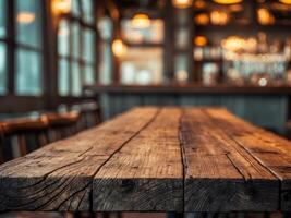 Rustic wooden table in a dimly lit bar setting photo