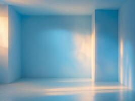 An empty room with blue walls and a light coming in photo