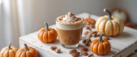 Pumpkin Spice Latte with Mini Pumpkins and Nuts. photo