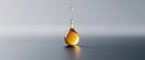 The image shows a single drop of honey on a black surface photo