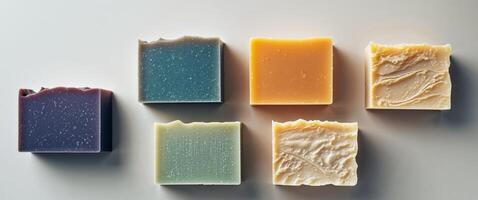 Four Rectangular Bars of Soap with Varying Colors and Textures. photo