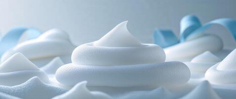 Soft white foam texture with subtle light blue accents for design and backgrounds. photo