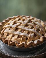 Freshly Baked Pie with Lattice Crust and Powdered Sugar on Wooden Tray Surrounded by Blurred Green Background Perfect for Fall and Recipes. photo