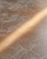 A close up of a marble surface with a light shining through it photo