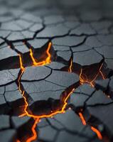 A close up of a cracked surface with orange and black lava photo