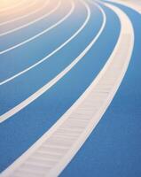 A running track with a line of white lines photo