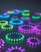 A group of colorful gears on a dark background photo
