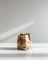 Empty Brown Paper Bag on a White Surface photo