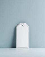 Blank white tag on blue background photo