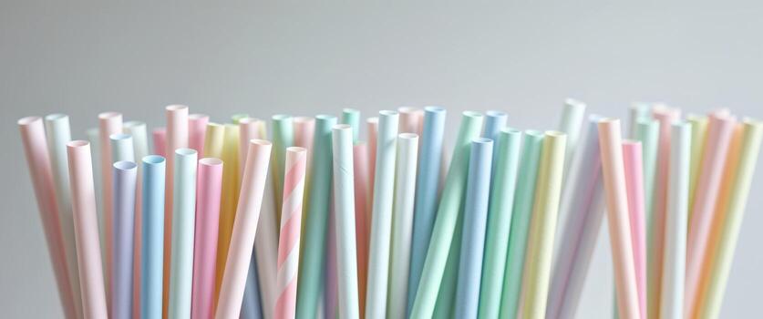 Array of Colorful Diagonal Straws in Pastel Shades Creating an Aesthetic and Playful Background photo