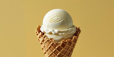 Vanilla Ice Cream in Waffle Cone on Yellow Background photo
