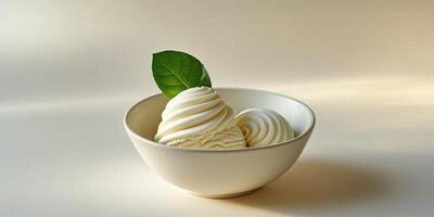 Ice cream in a bowl with a leaf on top photo