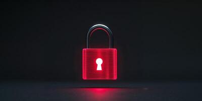 A red padlock with a keyhole on a dark background photo