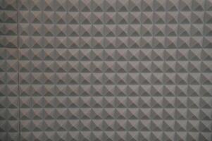 Textured background of a grey wall. Audio isolation euqipment photo
