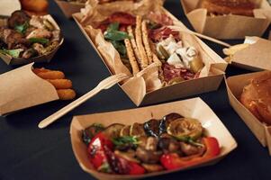 Top, view of, table with food, on it. Meat, vegetables, French fries, burger, mushrooms photo