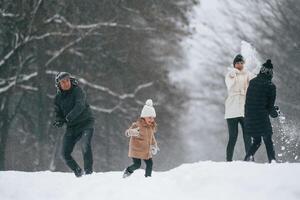 Active, people. Happy family is outdoors, enjoying, snow time at winter together photo