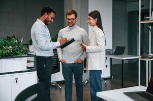 Financial questions. Couple are in the office, getting consulted by a manager photo