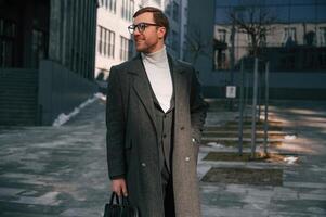 Standing, near, business building. Handsome man in formal clothes is outdoor photo