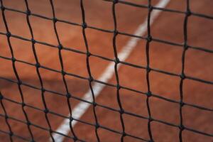 Close up view of the tennis net on the court photo