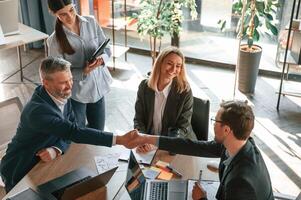 Top view. Group of business people,are, working in the modern office photo