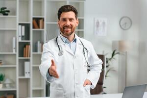 With ,stethoscope.. Doctor in formal clothes is working in the cabinet photo