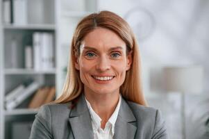 Portrait, of woman in business formal clothes that is in the office photo