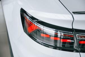 Close up view of ,the rear part of the modern white car photo