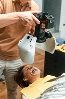 Woman in the stomatology, clinic, visiting dentist, installing the aligner photo