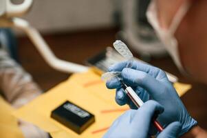 The ,aligner. Close up view of dentist equipment. Doctor with gloves photo