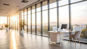 Modern office with large windows, wooden floors, and a desk overlooking a scenic cityscape at sunset, creating a serene and productive atmosphere. photo