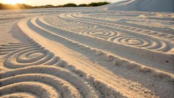 Intricate spiral patterns etched into smooth, white sand under a warm sunset sky, creating a mesmerizing contrast of nature and artistry. photo