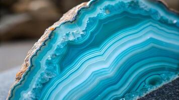 Vibrant turquoise agate slice with intricate banding patterns and a smooth, polished surface showcasing the natural beauty of the mineral. photo