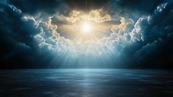 Majestic clouds parting to reveal bright sun over calm waters photo