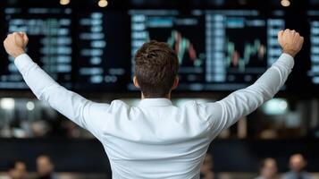 corporate CEO celebrating successful IPO announcement with excitement photo