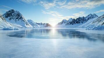 serene winter landscape with mountains and frozen lake reflecting sunlight photo